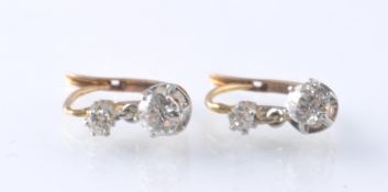 A PAIR OF FRENCH 18CT GOLD PLATINUM AND DIAMOND DROP EARRINGS
