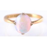 A HALLMARKED 22 CT GOLD OPAL CABOCHON RING
