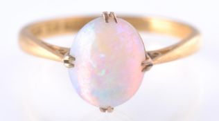 A HALLMARKED 22 CT GOLD OPAL CABOCHON RING
