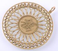 A LARGE GOLD CHINESE PENDANT