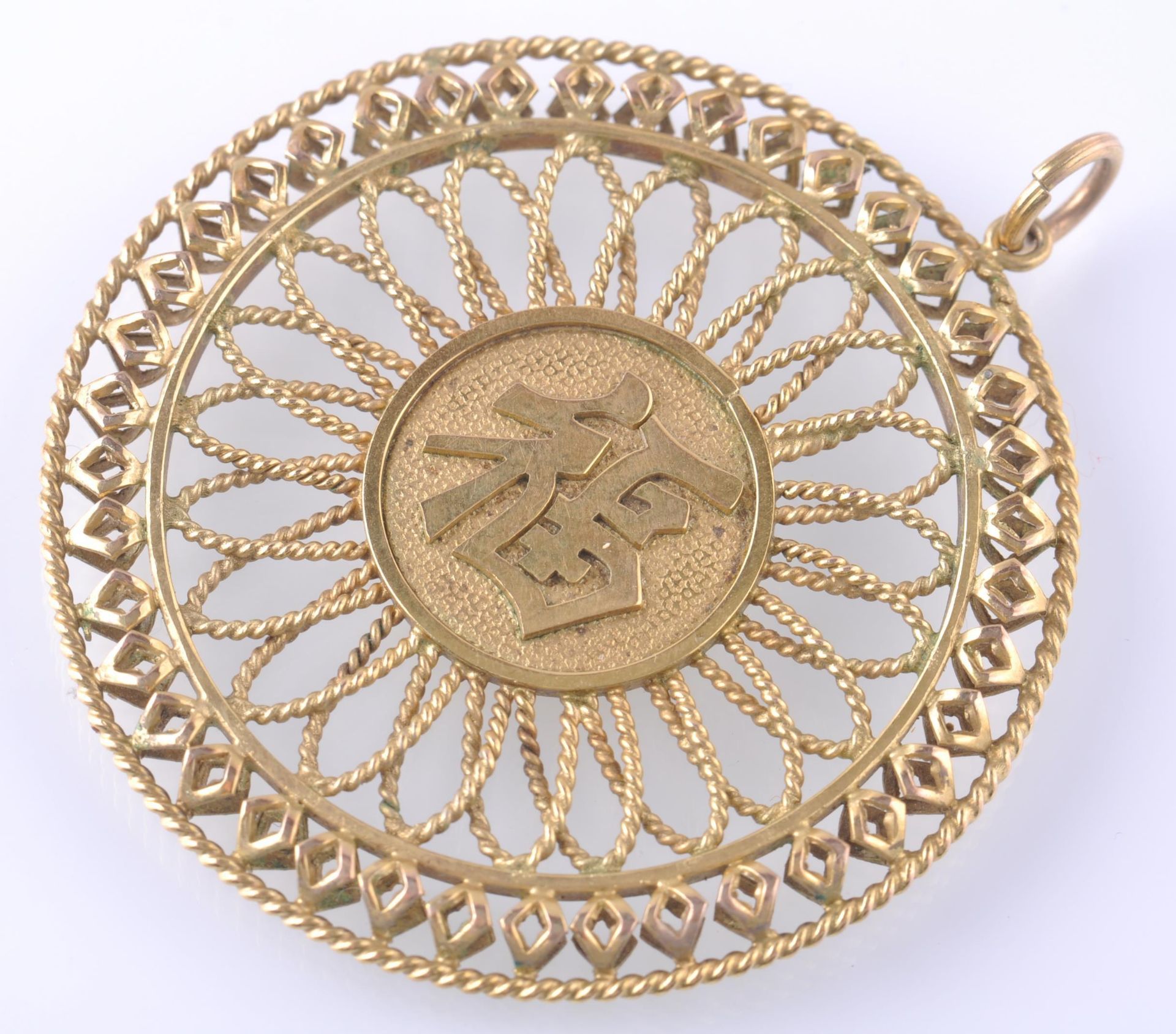 A LARGE GOLD CHINESE PENDANT