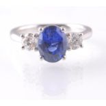 A PLATINUM SAPPHIRE & DIAMOND THREE STONE RING.