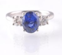 A PLATINUM SAPPHIRE & DIAMOND THREE STONE RING.