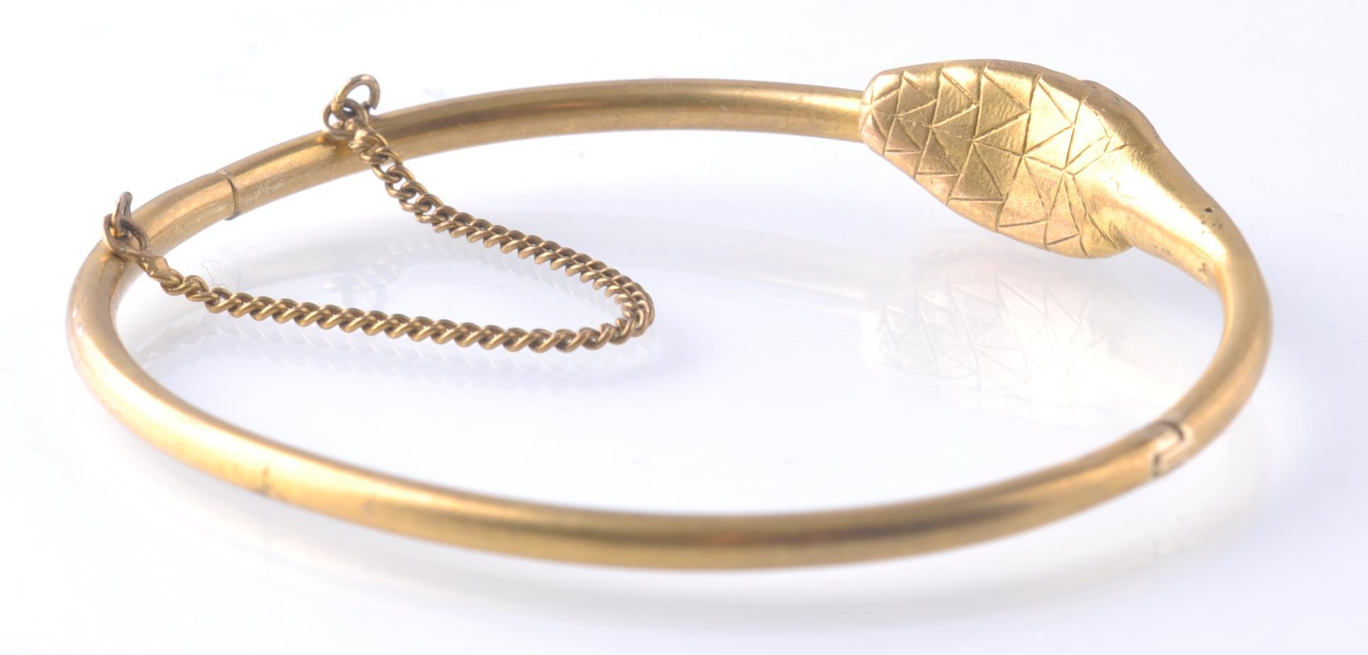 AN ANTIQUE OUROBOROS GOLD AND RUBY SNAKE BANGLE - Image 4 of 4