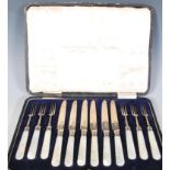 A cased set of early 20th Century Thomas Bradbury & Sons silver cutlery / flatware having mother