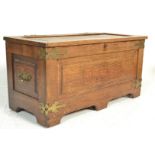 A 20th centurty Arts & Crafts oak  blanket box chest. Of rectangular form with carved detailing,