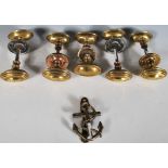 A group of five pairs of 19th Century Victorian brass door handles of oval stepped form. Each pair
