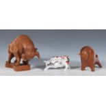 A retro mid 20th Century carved wood figure in the form of a charging bull in the manner of