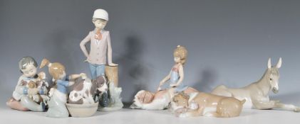 A collection of Lladro figurines to include a Nativity Donkey 5483,  little girl brushing a large