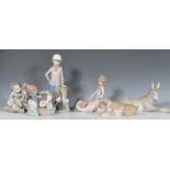 A collection of Lladro figurines to include a Nativity Donkey 5483,  little girl brushing a large