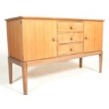 An original mid 20th Century vintage Gordon Russell walnut sideboard / dresser. Raised on squared