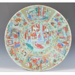 A 19th Century Chinese Canton famille verte wall charger plate having a round central panel hand