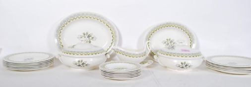 A vintage retro Wedgwood Harvest Festival pattern dinner service designed by Ravilious having yellow