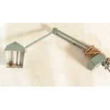 A vintage retro 20th Century industrial desk mounted lamp raised on square adjustable bracket. The