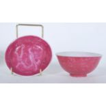 A 19th Century Chinese porcelain bowl having a pink ground with engraved Chinese dragon decoration
