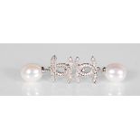 A pair of silver designer style earrings set with CZ's having pearl droplets. Gross weight 5.6g.
