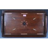 A 20th Century African hardwood drinks occasional tray with ebony and bone geometric design inlay,