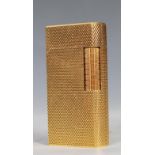 A vintage 20th Century Dunhill roller gas cigarette lighter of rectangular form having a gilt engine