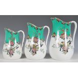 A set of three 19th Century Victorian era graduating ceramic water jugs having transfer printed