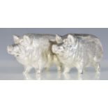 A pair of silver salt and pepper condiments in the form of pigs. Stamped 800. Total weight 116.8g.