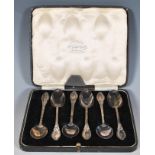 A cased set of six silver hallmarked teaspoons, scroll work detail, Birmingham assay mark, rubbed