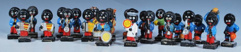 A selection of vintage 20th Century Robertson Golly figures to include a group of band figures and a