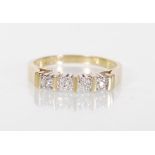 A stamped 9ct yellow gold ring having a decorative pierced mount set with white stone with gold