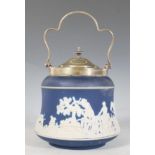 A 19th Century Adams of Tunstall blue and white jasperware biscuit barrel depicting a fox hunting