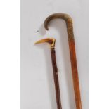 Two early 20th Century walking stick canes to include a malacca walking stick with a gold plated