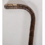 A late 19th Century Victorian crook handle, silver collar and tip walking stick cane. Silver