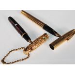 Two 20th Century writing pens to include a vintage gold plated Sheaffer ink pen having a 14ct gold