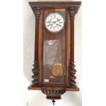 A Victorian 19th century walnut Vienna regulator wall clock with the dial marked Le Roi A Paris.