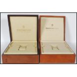 A pair of 20th Century mahogany watch cases, the h