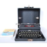 A vintage early 20th Century Royal Portable typewriter in fitted carry case, glass keys with Royal