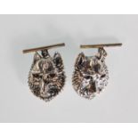 A pair of silver wolf mask cufflinks set with amethyst eyes. Stamped to verso 925. Gross weight 11.