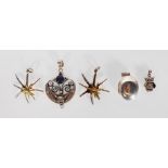 A selection of silver pendants to include an English hallmarked locket of oval form, an
