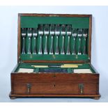 A 20th Century Hammond Creake & Co cutlery canteen set within a wooden case with hinged lid and