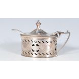 A late 19th Century high Victorian silver hallmarked mustard pot of oval form having shaped handle