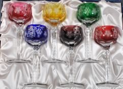 Chinacraft - A set of six 20th Century harlequin coloured glass wine glasses raised on cut