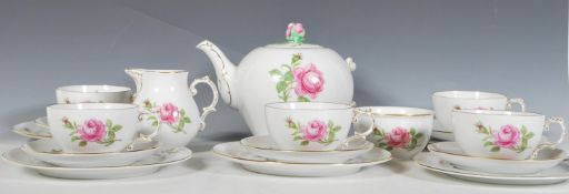 A mid 20th Century Furstenberg ceramic part tea service, hand decorated with pink roses consisting