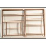 A near pair of 20th Century oak wall hanging sectional open display shelves, the shelves with a