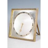 A 20th Century desk top clock having a square brass case with engine turned silver white metal