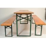 A vintage industrial / festival / garden Trestle table and two bench set with painted  pine tops and