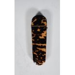 A 19th Century Victorian tortoiseshell glasses case of tapering rectangular form having domed