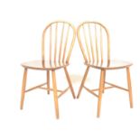 A pair of retro mid 20th Century Danish Billund Stolefabrich hoop and spindle back dining chairs