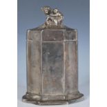 A 20th Century white metal tea caddy case having a cast finial the top in the form of a monkey