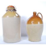 Two large vintage 20th Century stoneware / salt glaze pot flagons one having a loop handle and the