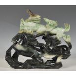 A well carved Chinese jadite carved figural sculpture carving of six galloping horses, the mottled