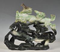 A well carved Chinese jadite carved figural sculpture carving of six galloping horses, the mottled