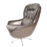 A 20th Century retro 1970's swivel egg chair - armchair button back being raised on a chrome prong